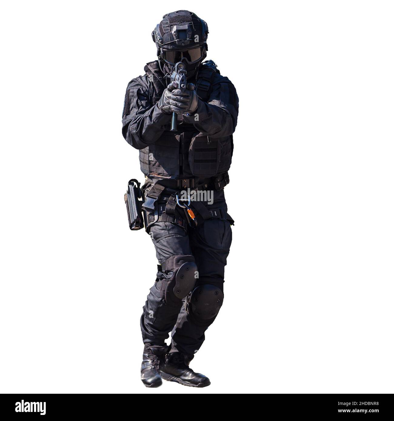 Special forces member in action isolated on white background, unmarked and unrecognizable SWAT officer Stock Photo