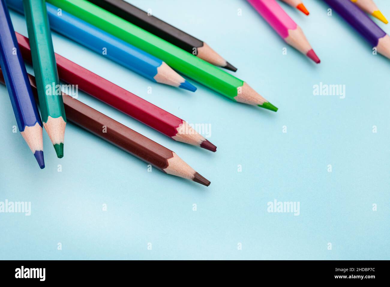 Colored pencils on bright colored background Stock Photo