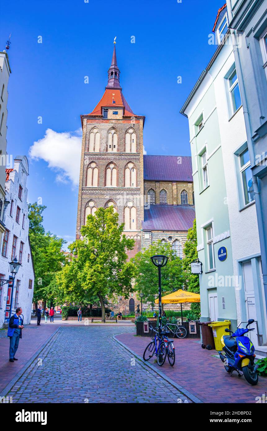 Hanseatic City of Rostock, Mecklenburg-Western Pomerania, Germany: Urban scene in front of St. Mary's Church as seen from Kröpeliner Strasse. Stock Photo