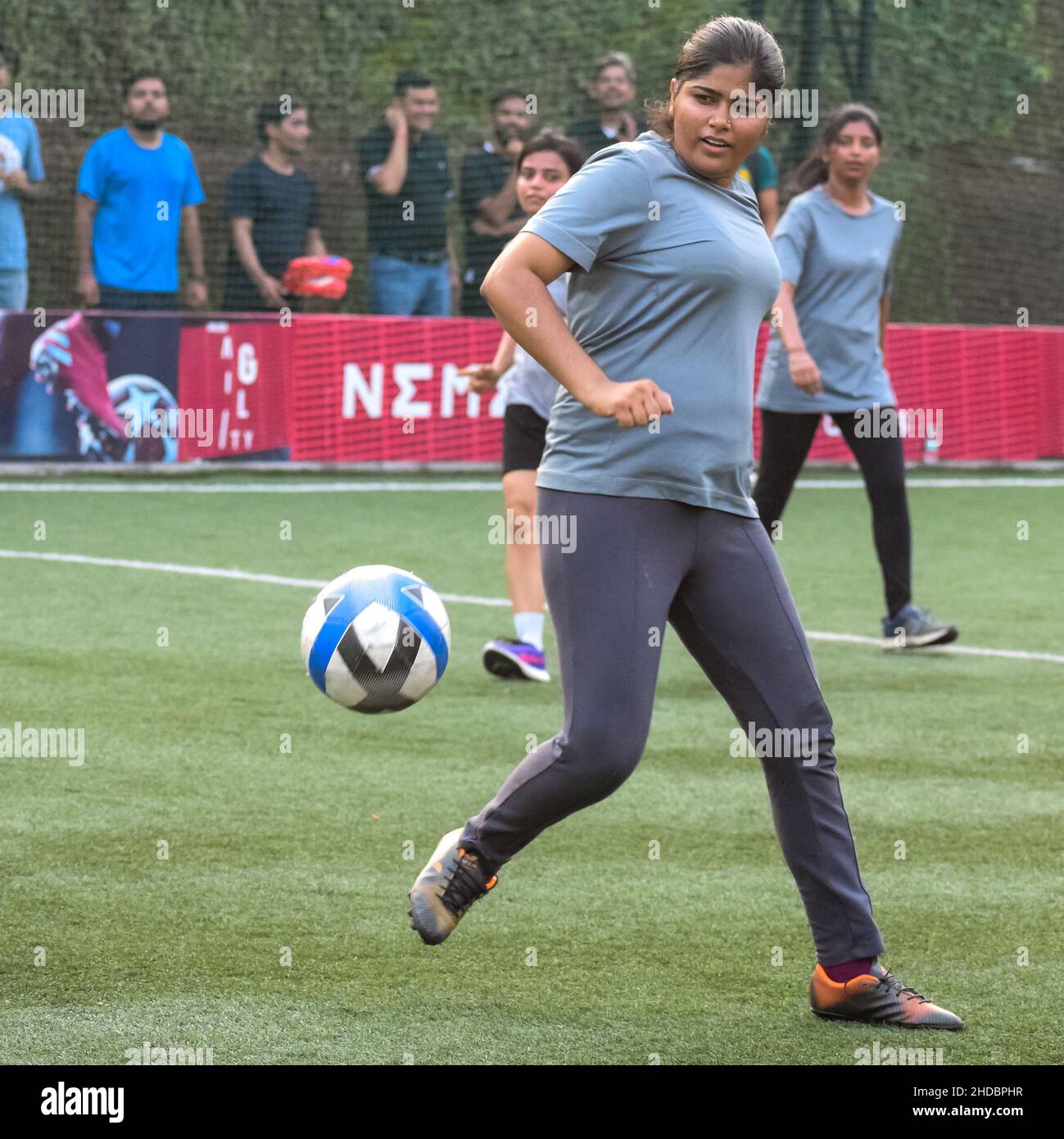 New Delhi, India - July 01 2018: Women Footballers of local football team  during game in regional championship on bad football pitch. Hot moment of  fo Stock Photo - Alamy