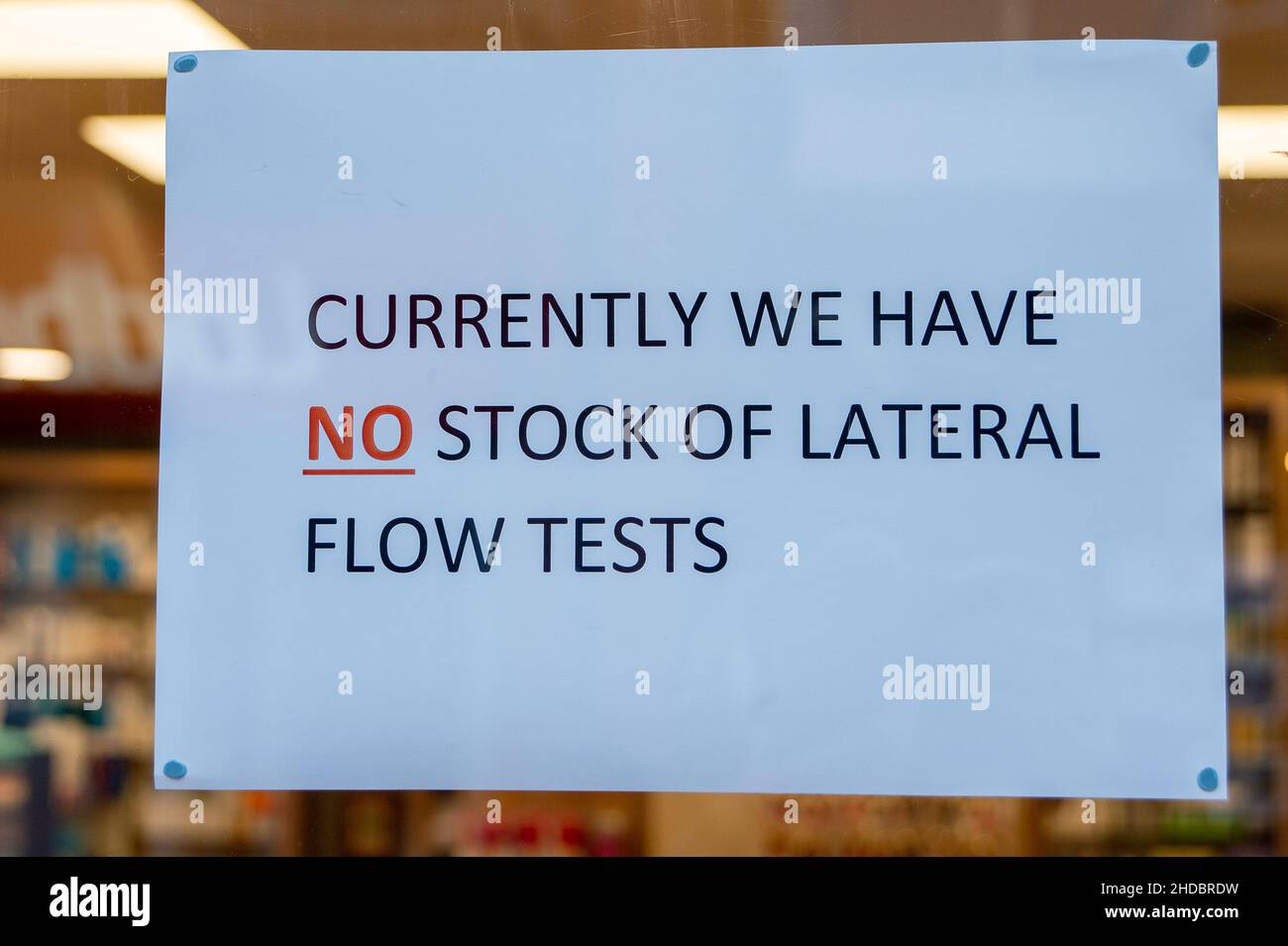Egham, Surrey, UK. 5th January, 2022. A sign in a pharmacy window in Egham town centre tells customers that there are no stocks of Covid-19 Lateral Flow tests available today. Yesterday the UK had the highest ever number of positive Covid-19 cases recorded, however, Prime Minister Boris Johnson is not taking any further measures to reduce the spread of the disease. Credit: Maureen McLean/Alamy Live News Stock Photo