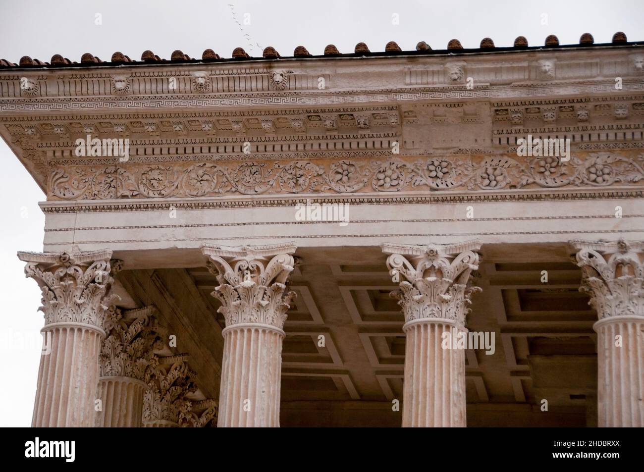 Frieze and Corinthian capitals of Maison Carrée in Nîmes, France. Stock Photo