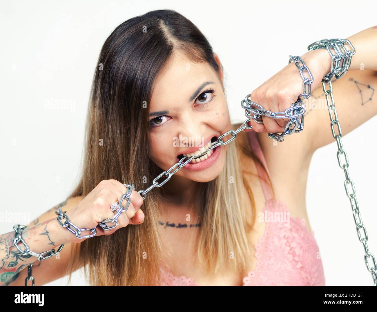 Attractive Young Woman Shackled In Chains Stock Photo, Picture and Royalty  Free Image. Image 5202772.