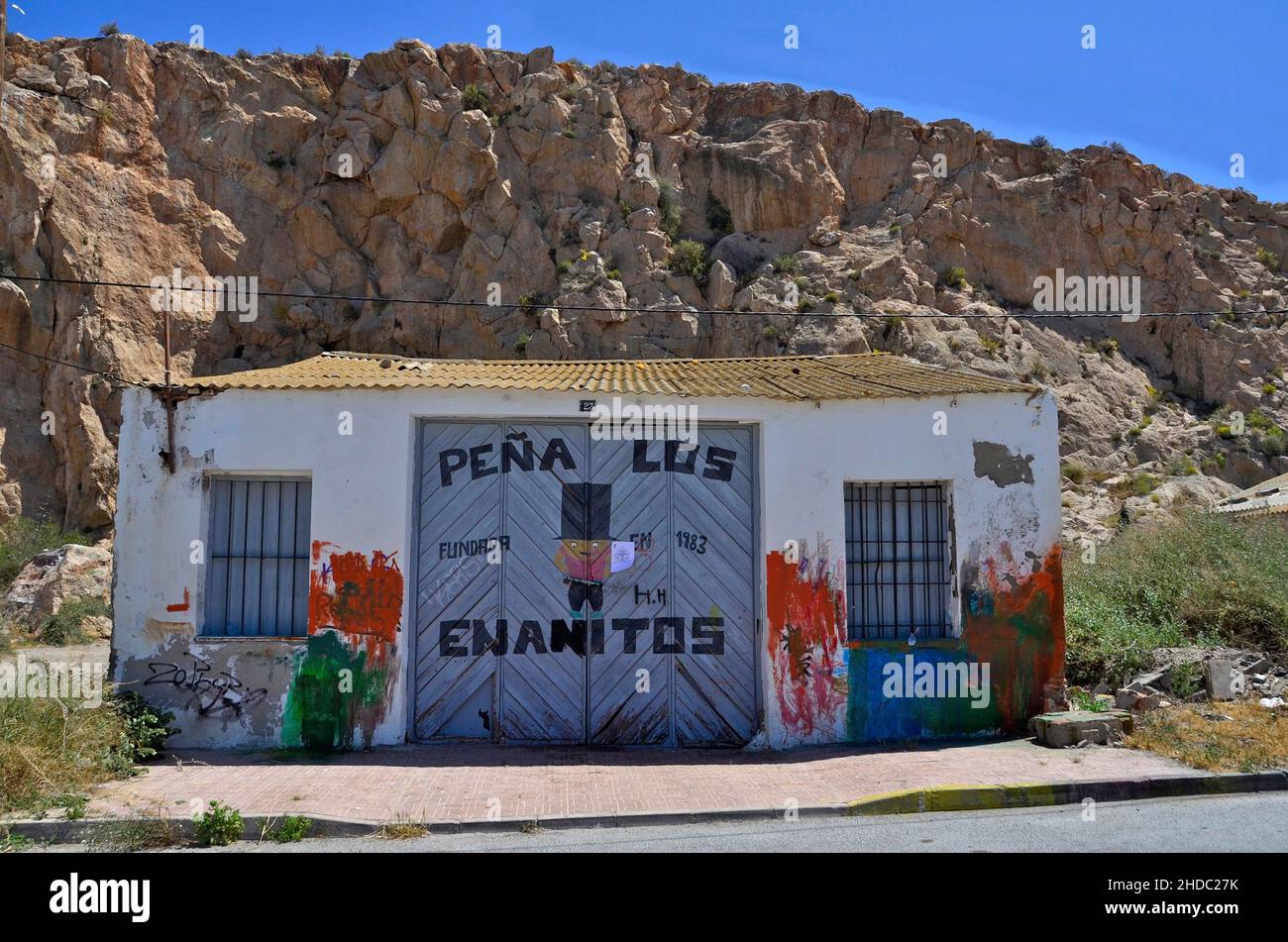 Boat shed with graffiti painted door in Aguilas, Murcia, Spain Stock Photo