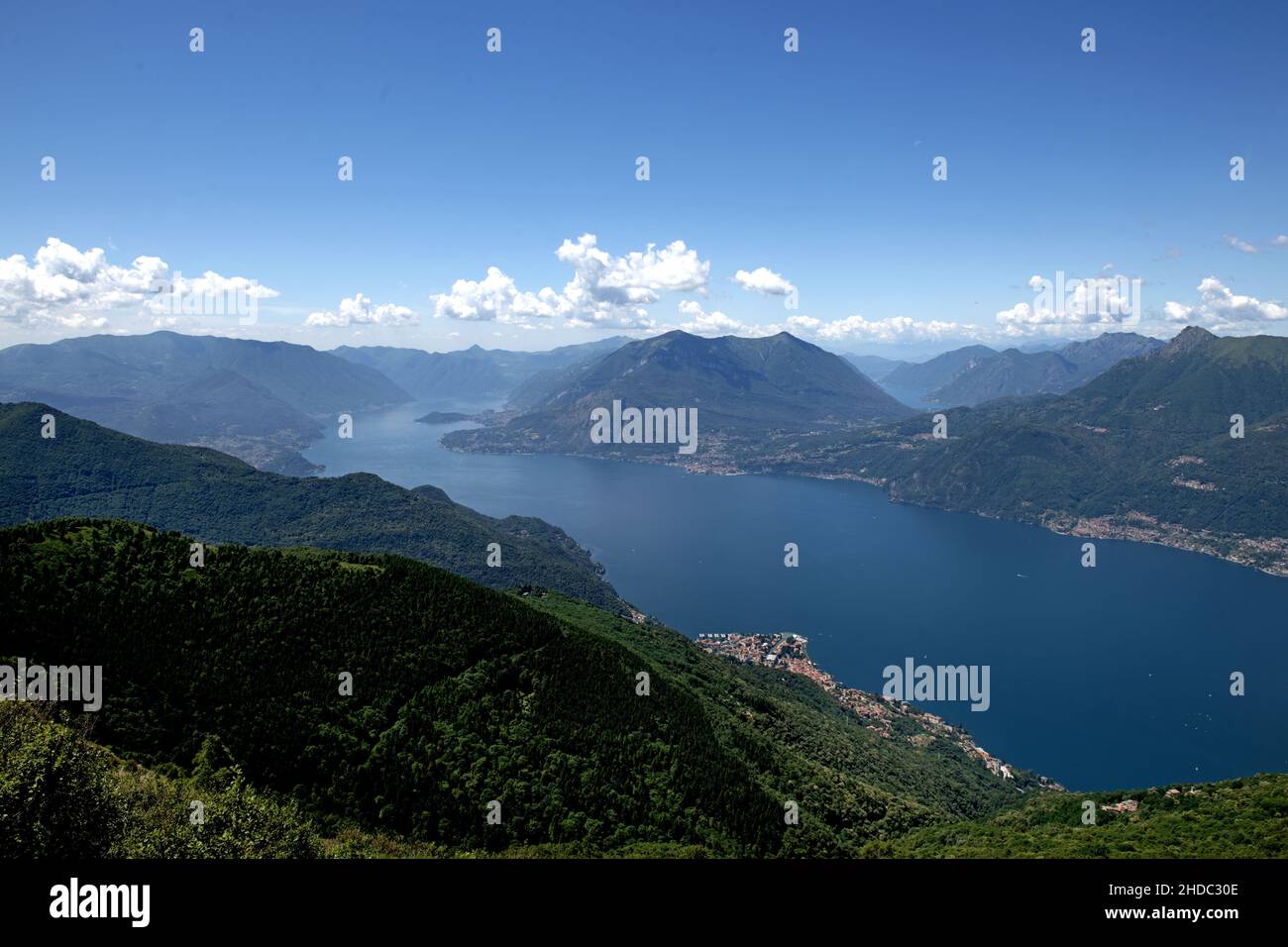 Top view of Lake Como and the Alps surround it on a summer trekking. Stock Photo
