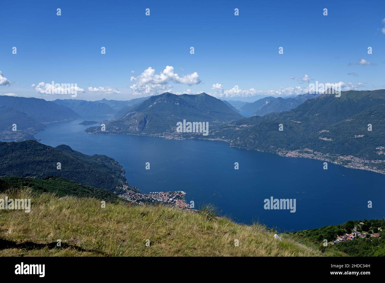 Top view of Lake Como and the Alps surround it on a summer trekking. Stock Photo
