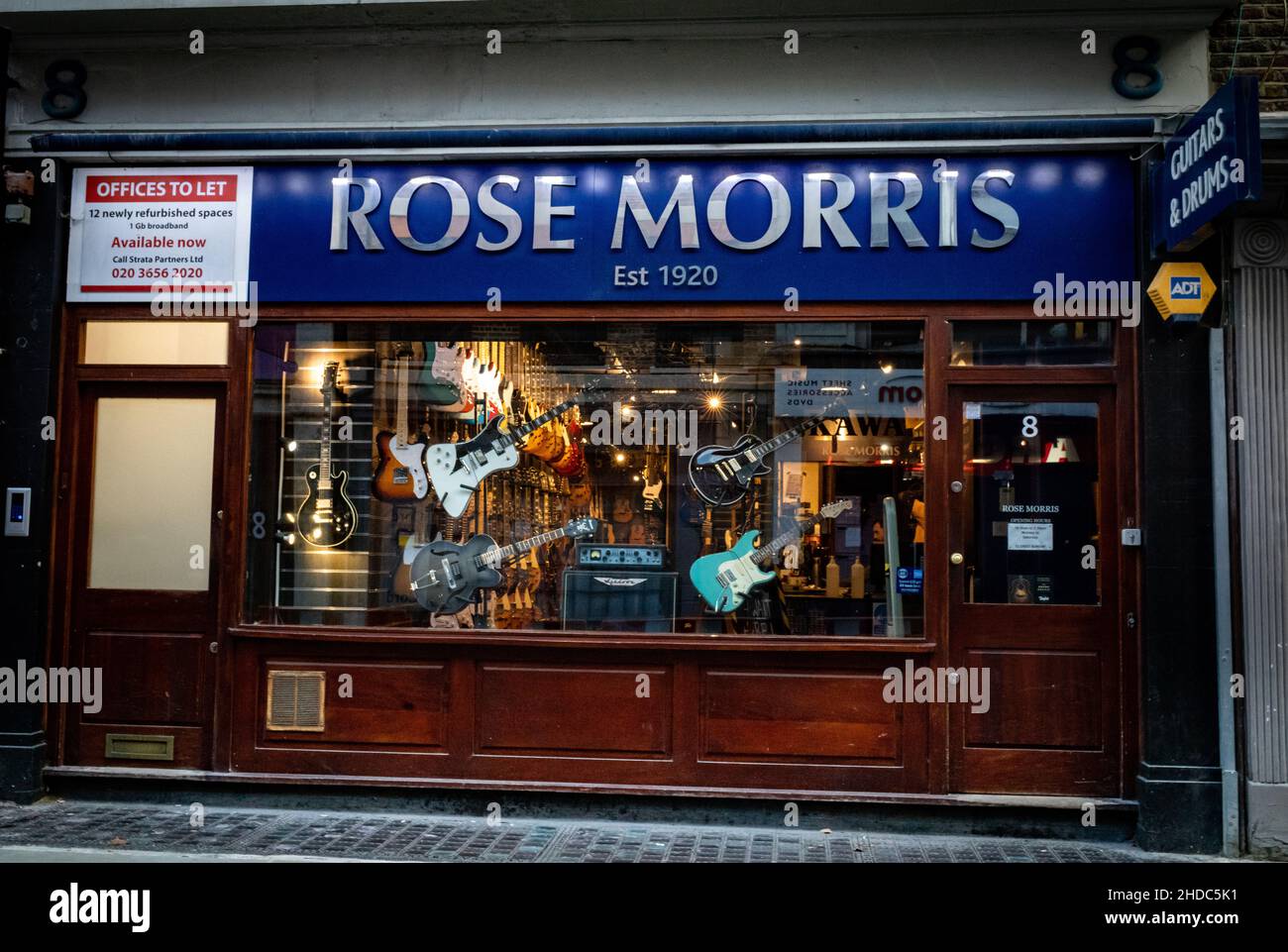 Rose Morris music shop in Denmark Street, central London, UK. Denmark St, otherwise known as Tin Pan Alley, was the hub of the British music scene for Stock Photo