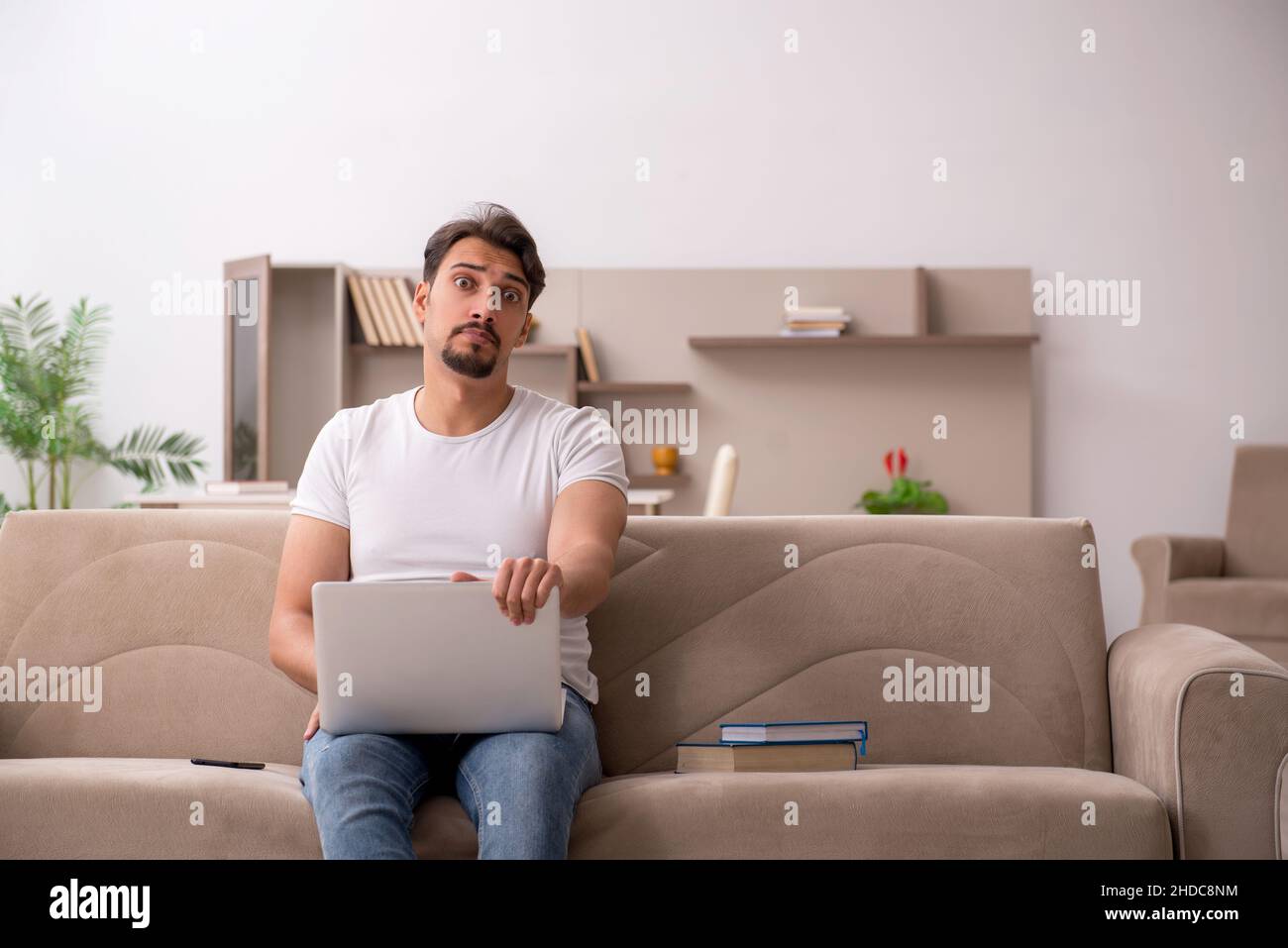 Young student studying at home during pandemic Stock Photo - Alamy