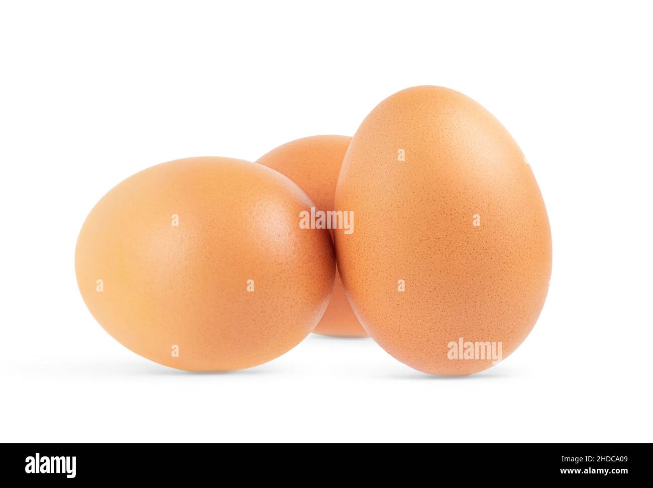 Three brown eggs isolated on white background. Close up Stock Photo