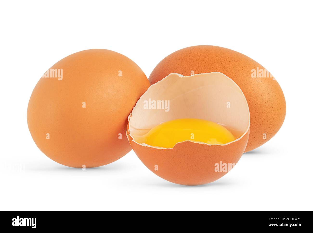 Composition of eggs with broken one isolated on white background. Close up Stock Photo