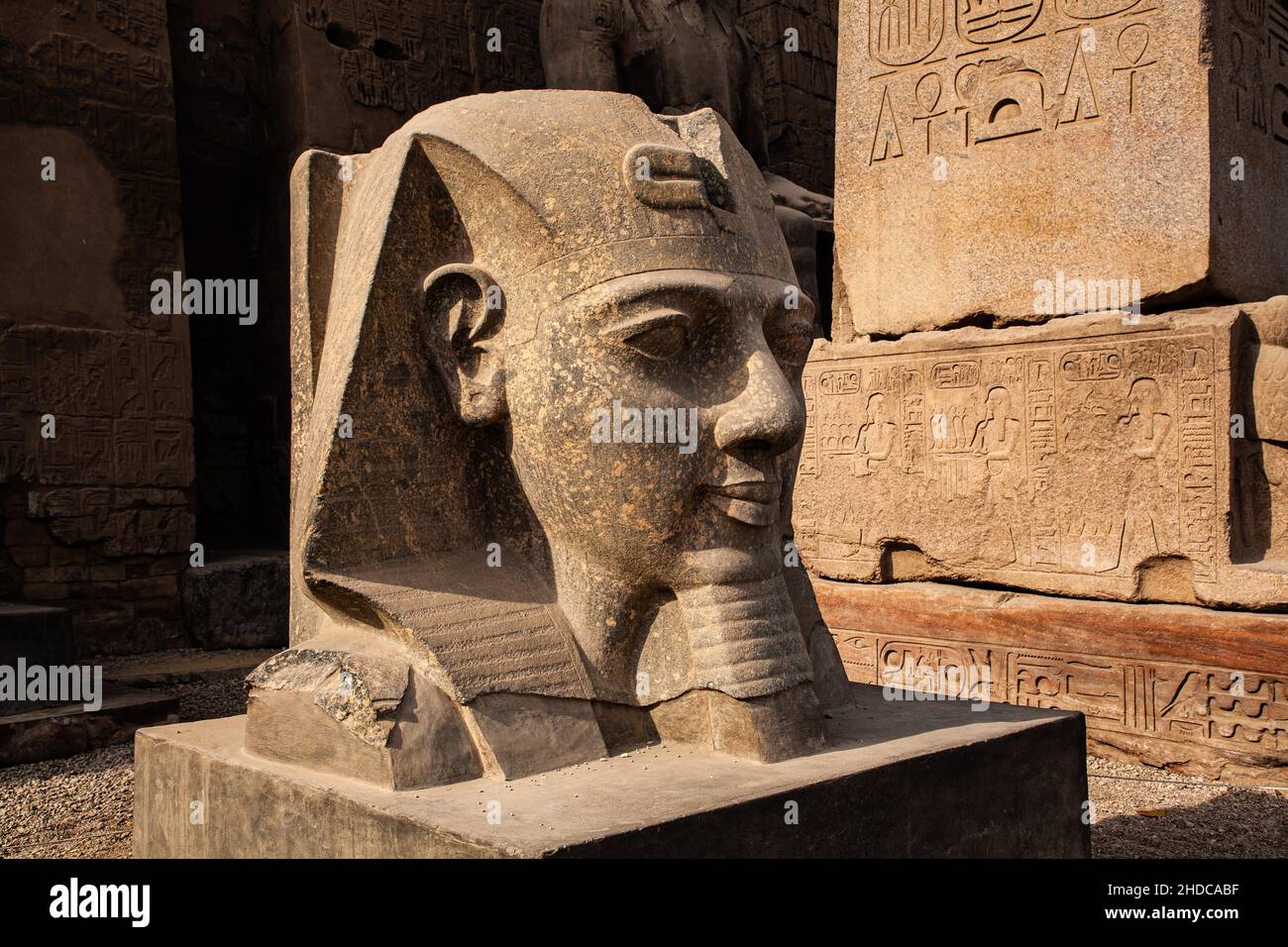 Head of a statue of Ramses II at the entrance pylon, Luxor Temple ...