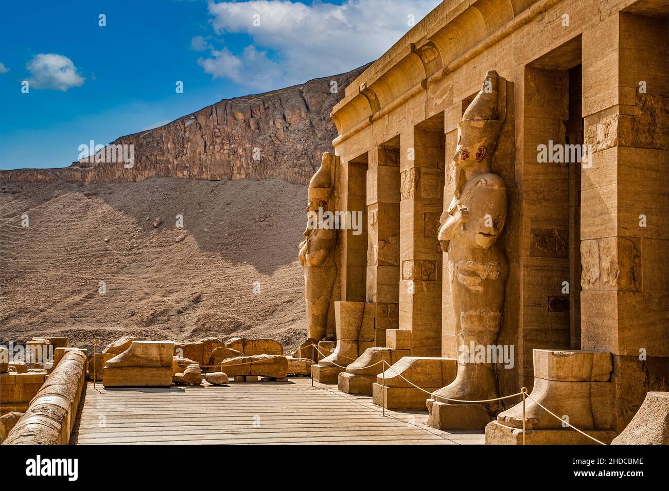 Hatshepsut's larger-than-life (5 m) statues of Osiris in the central colonnade, statues in the robes of the god Osiris, funerary temple of the pharaoh Stock Photo