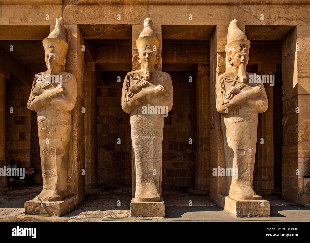 Hatshepsut's larger-than-life (5 m) statues of Osiris in the central colonnade, statues in the robes of the god Osiris, funerary temple of the pharaoh Stock Photo
