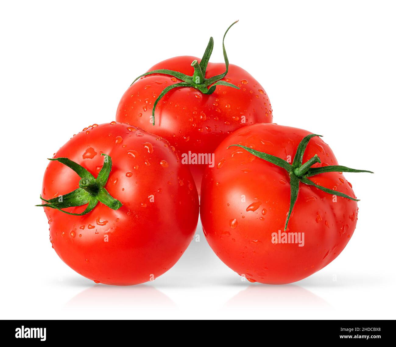 Three isolated tomatoes on white background. Stock Photo