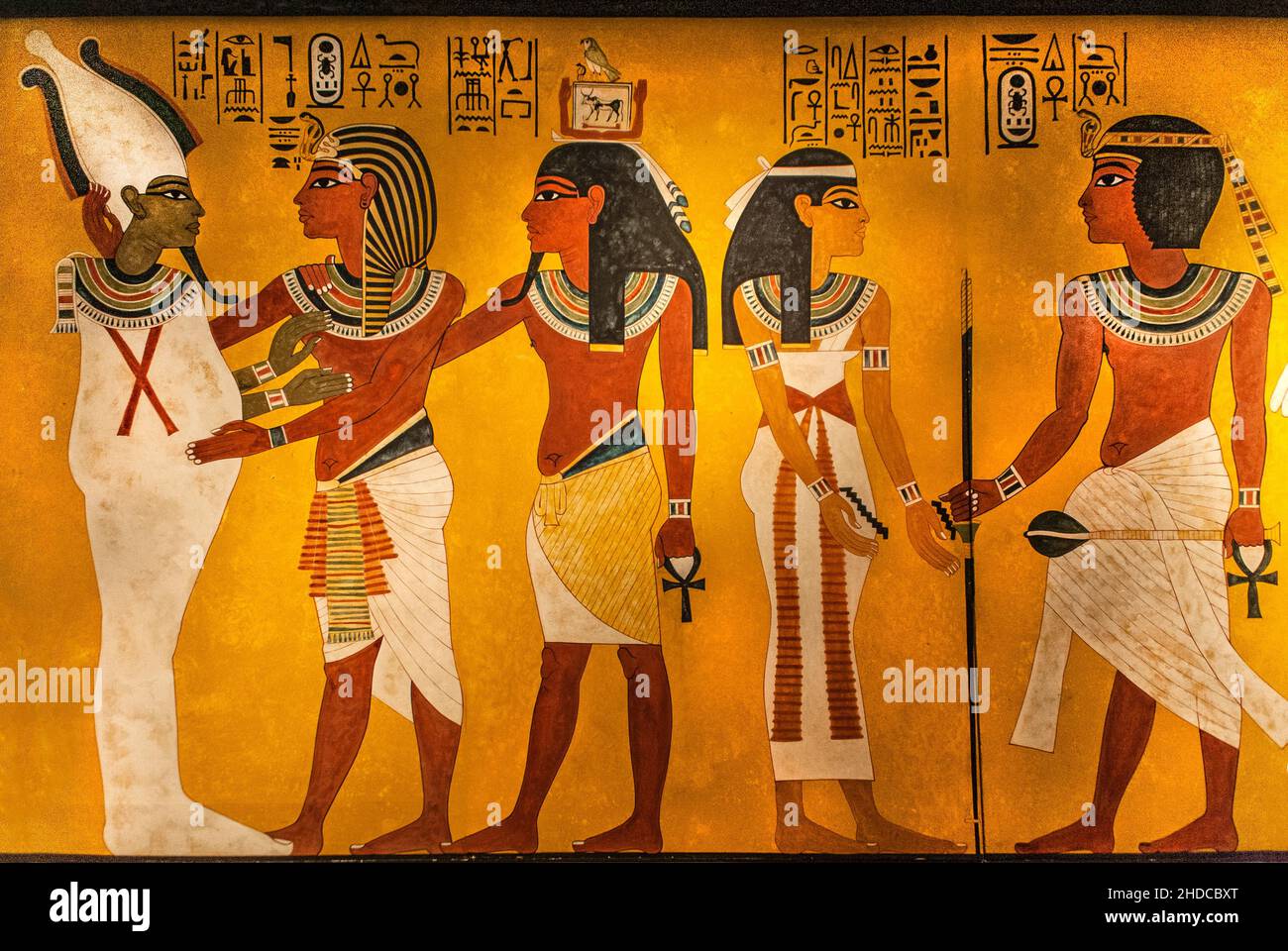 King Tutankhamun embraces the god of the dead Osiris, followed by his Ka, symbol of vitality, Tutankhamun's burial treasures, world archaeological sen Stock Photo