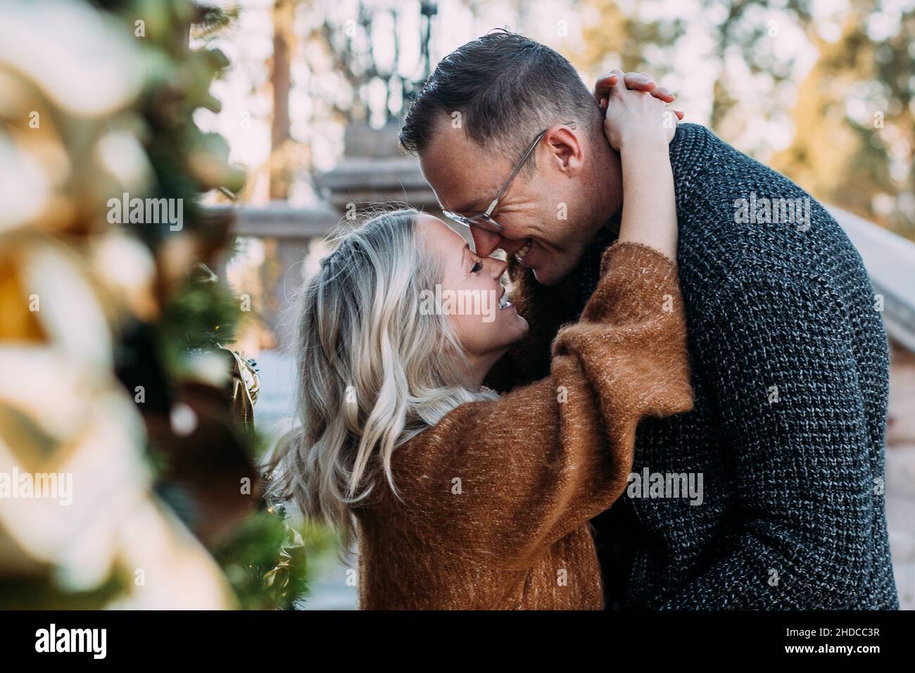 Married couple happily embrace outside Stock Photo