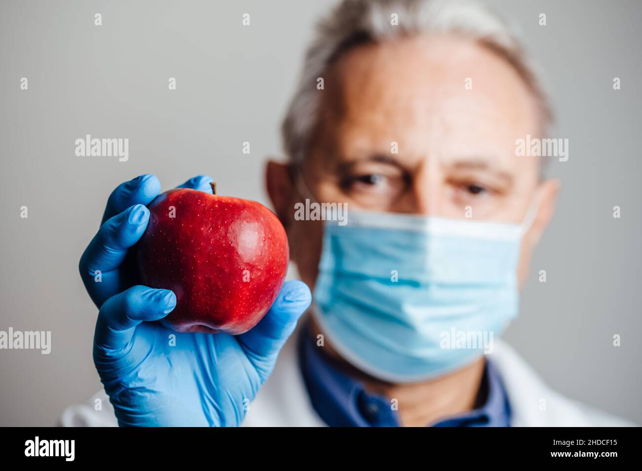 Medical Doctor Holding An Apple Stock Photo Alamy
