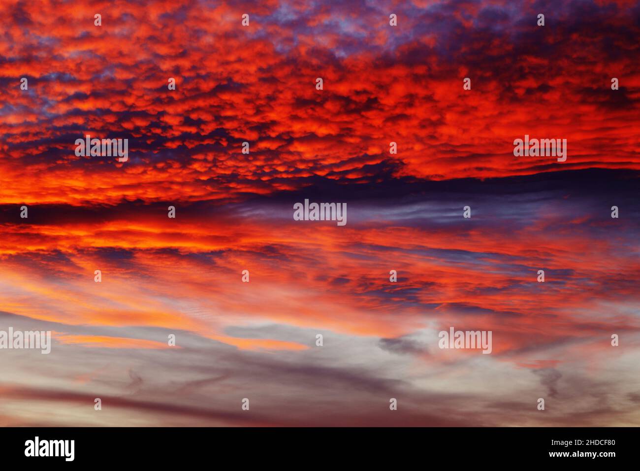 Amazing Dramatic Sunset Sky with Red Clouds Stock Photo