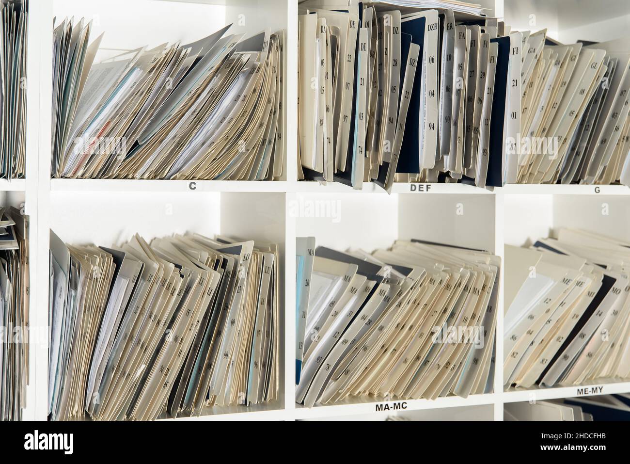 Shelves are full with folders and files of medical record, patient