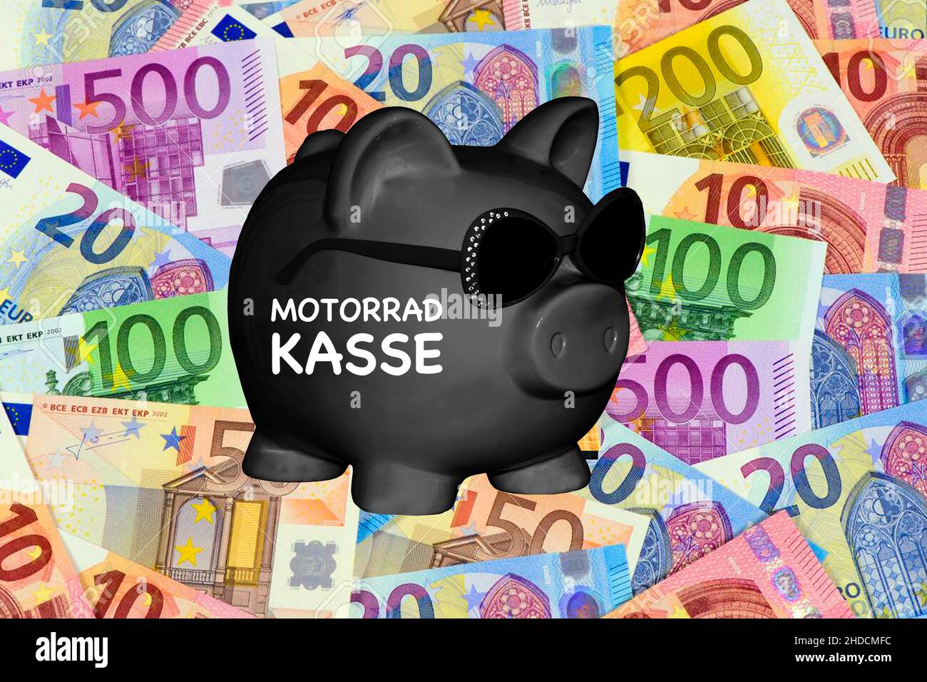 SChwarzes Sparschwein, Aufdruck: Motorradkasse, Kauf, Leasing, Anschaffung, Planung, Biker, Benzinkosten, Reparaturkosten, Vorsorge, Stock Photo