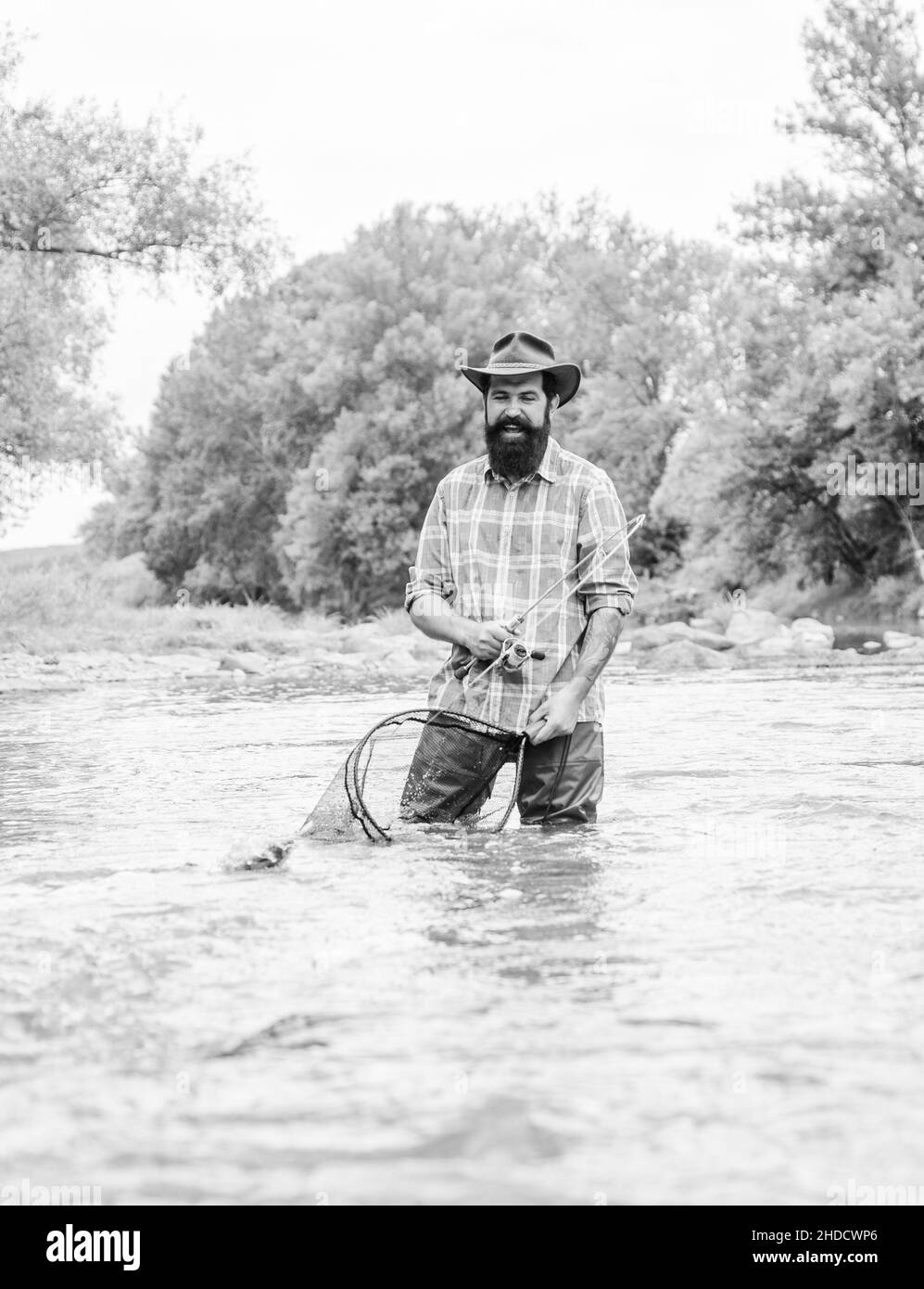 keep it reel. summer weekend. Fly fishing. mature man fly fishing. man