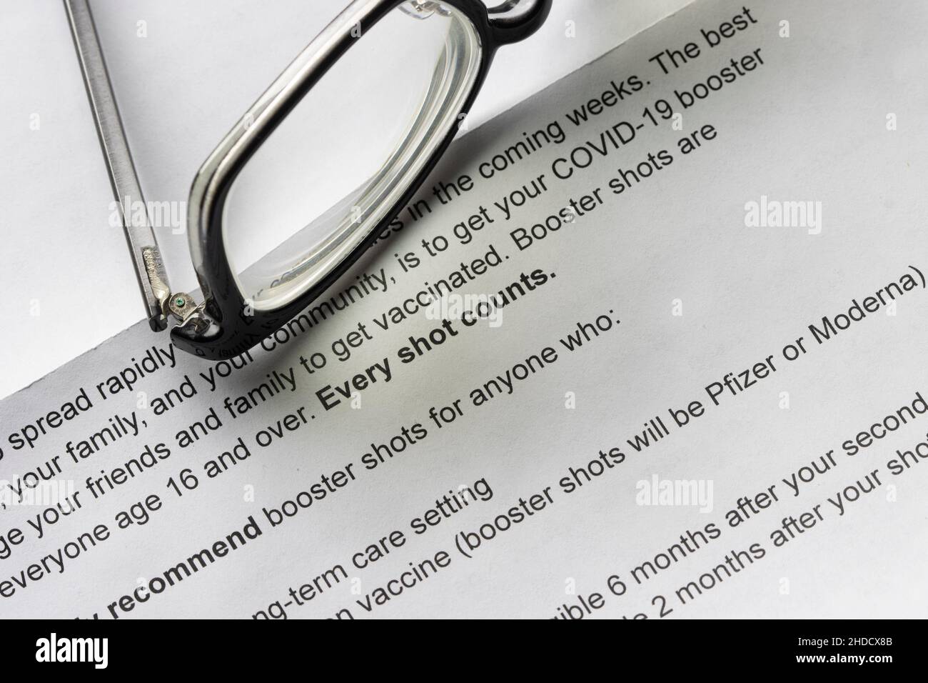 Every shot counts. Closeup of a government letter that encourages residents to receive COVID-19 booster shots amid omicron variant surge. Stock Photo