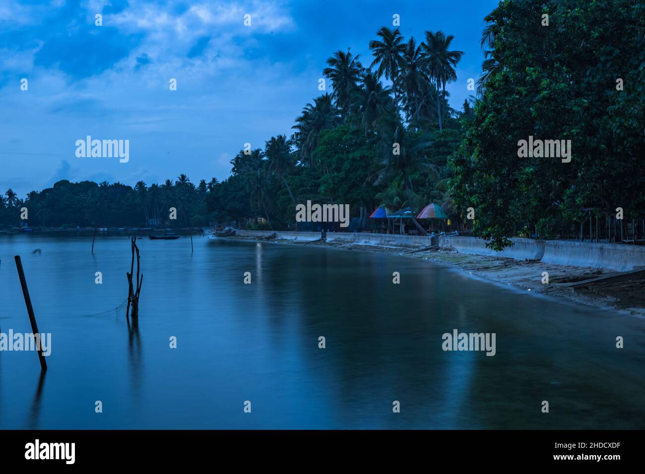Mesmerizing scene of the magic blue water in the Islands in Batam, Indonesia in the evening Stock Photo