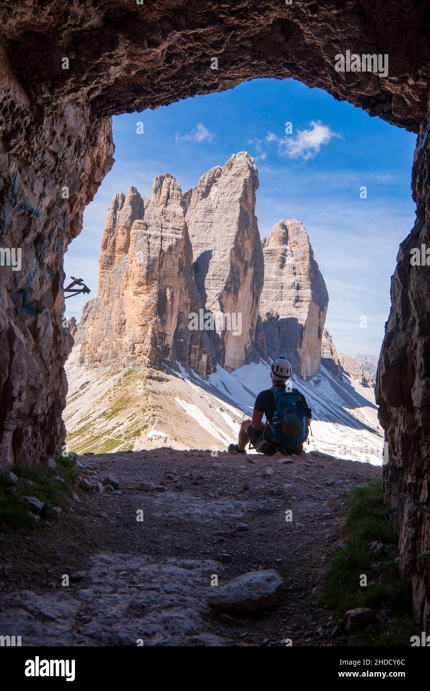Traveler Man relaxing meditation with serene view mountains and lake landscape Travel Lifestyle hiking concept summer vacations outdoor Stock Photo