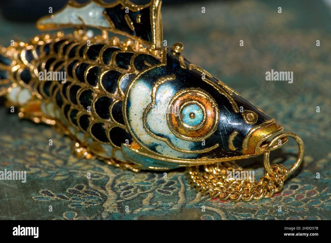 Articulated fish shop pendant meaning