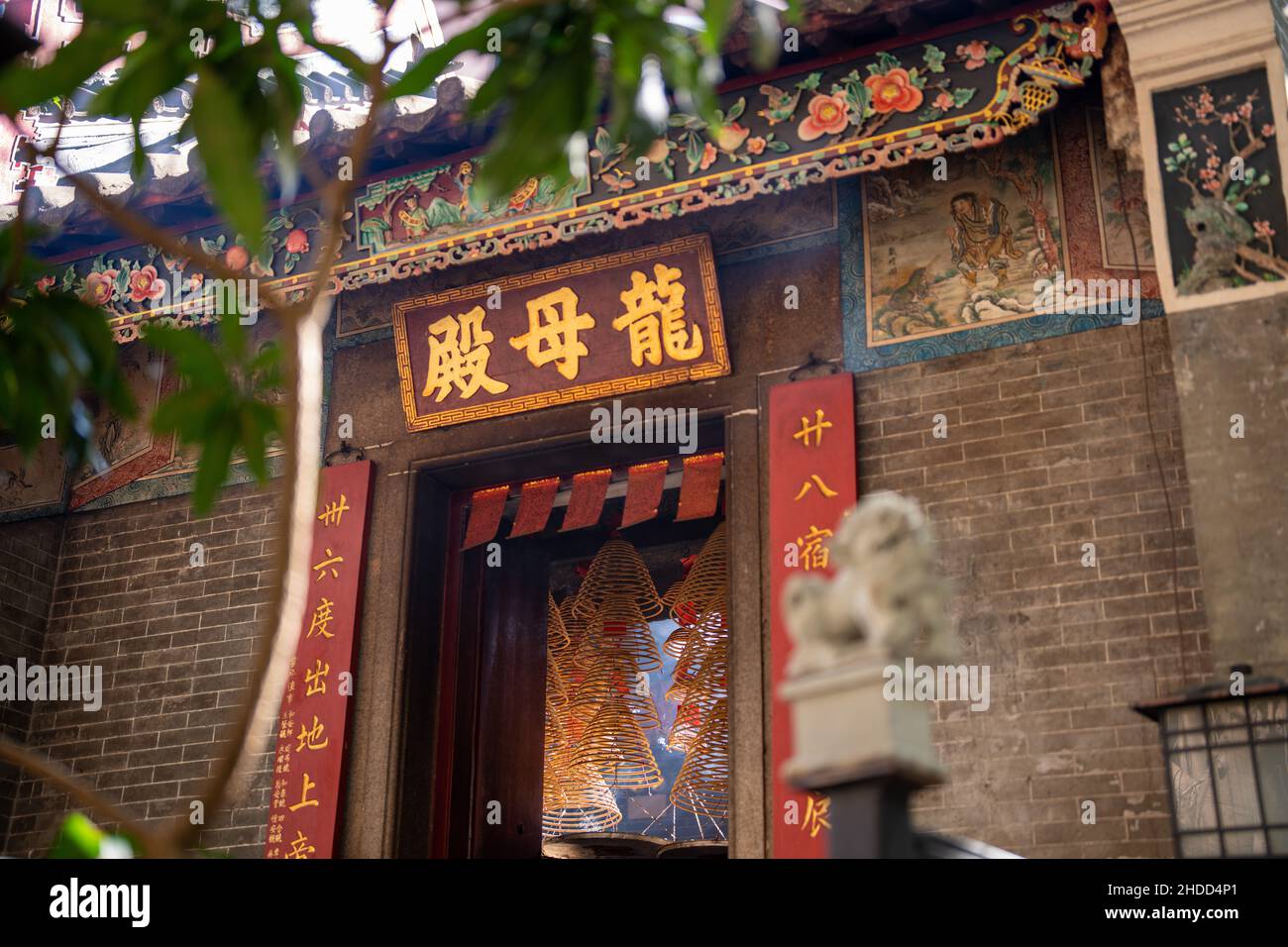Beautiful facade of the burning incense inside a Chinese temple in Hong
