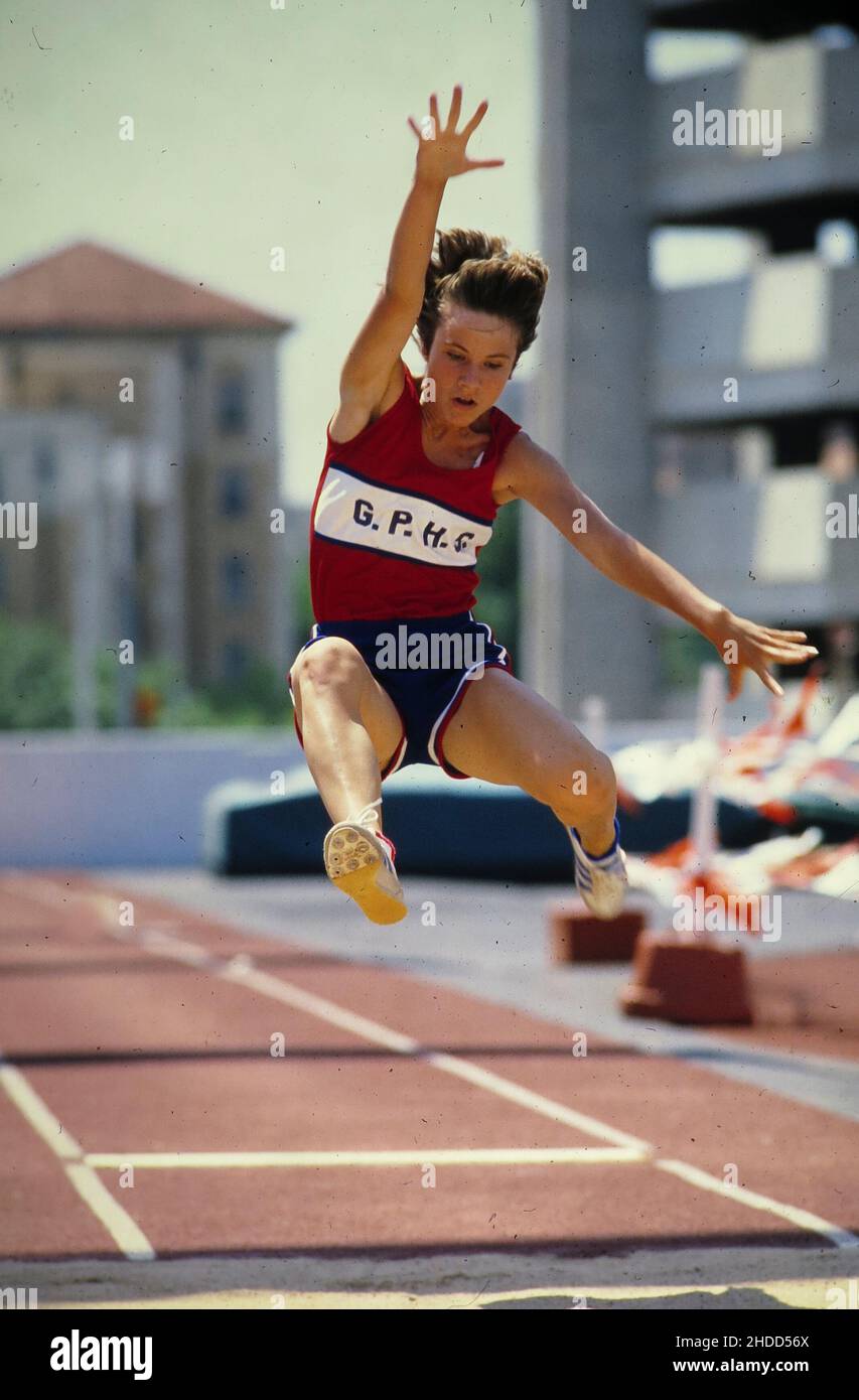 Austin Texas USA, 1992: Female high school long jumper competes at state track championship track and field meet. ©Bob Daemmrich Stock Photo