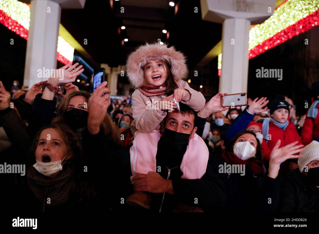 Children react as they see Gaspar, one of the Three Wise Men, during the annual Epiphany parade amid the coronavirus disease (COVID-19) surge in Madrid, Spain, January 5, 2022. REUTERS/Susana Vera Stock Photo