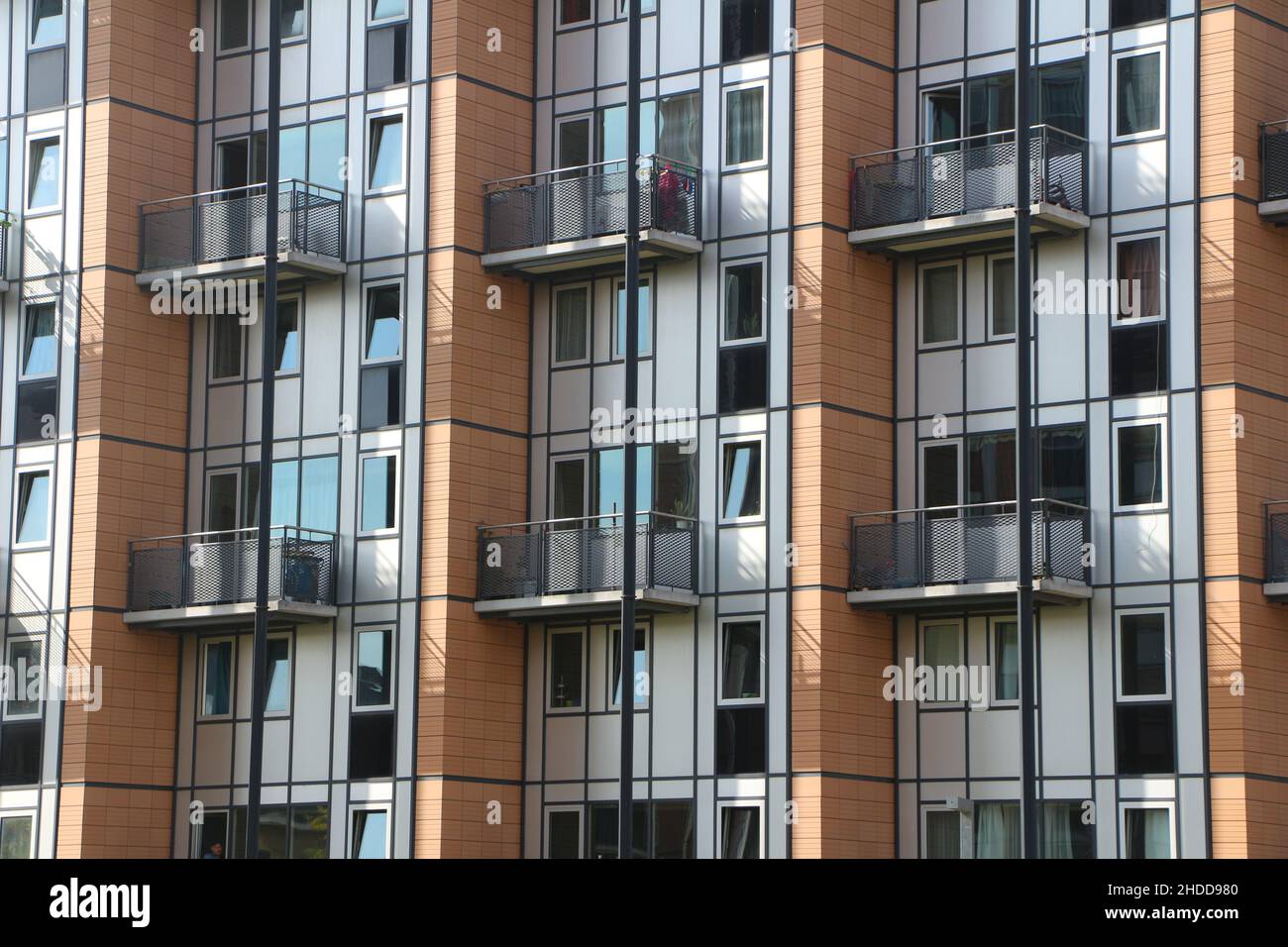 Facade of a building with many balconies and windows Stock Photo - Alamy