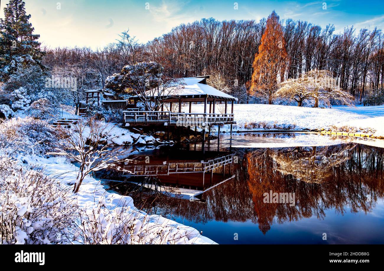 Japanese style Tea House in a Park pond in a winter setting Stock Photo