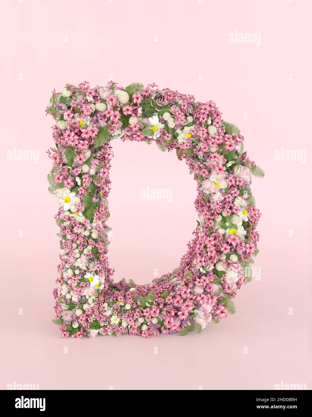 Creative letter D concept made of frash Spring wedding flowers. Flower font concept on pastel pink background. Stock Photo