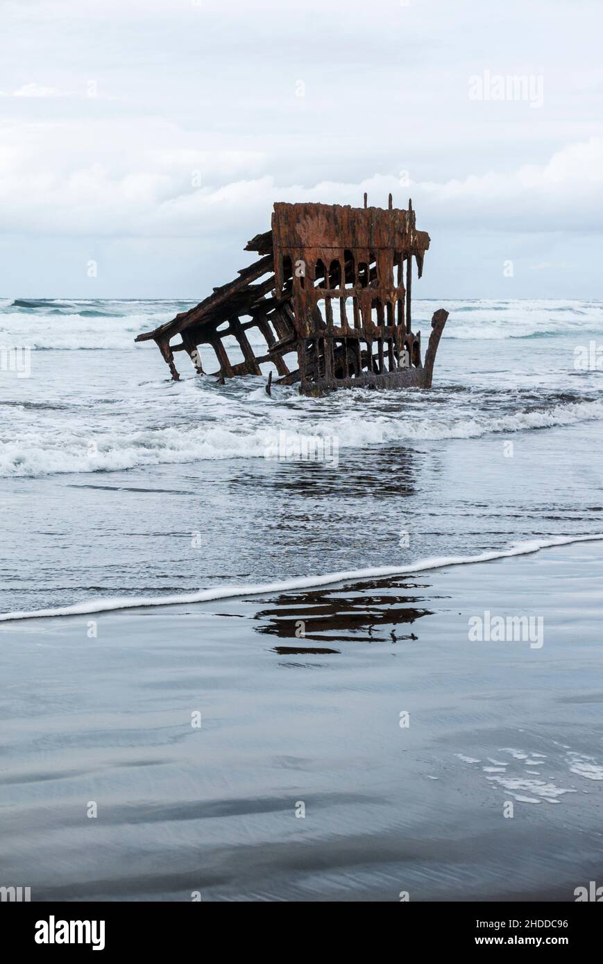 Pacific Ocean waves wash against ship wrecked Peter Iredale; Fort ...