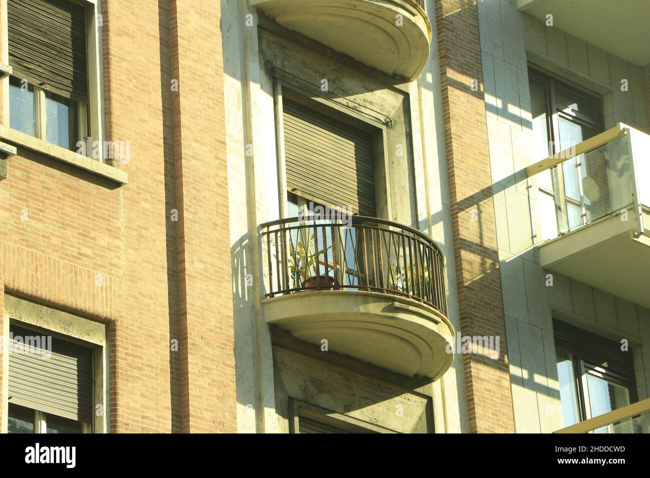 Brick building with an old balcony Stock Photo