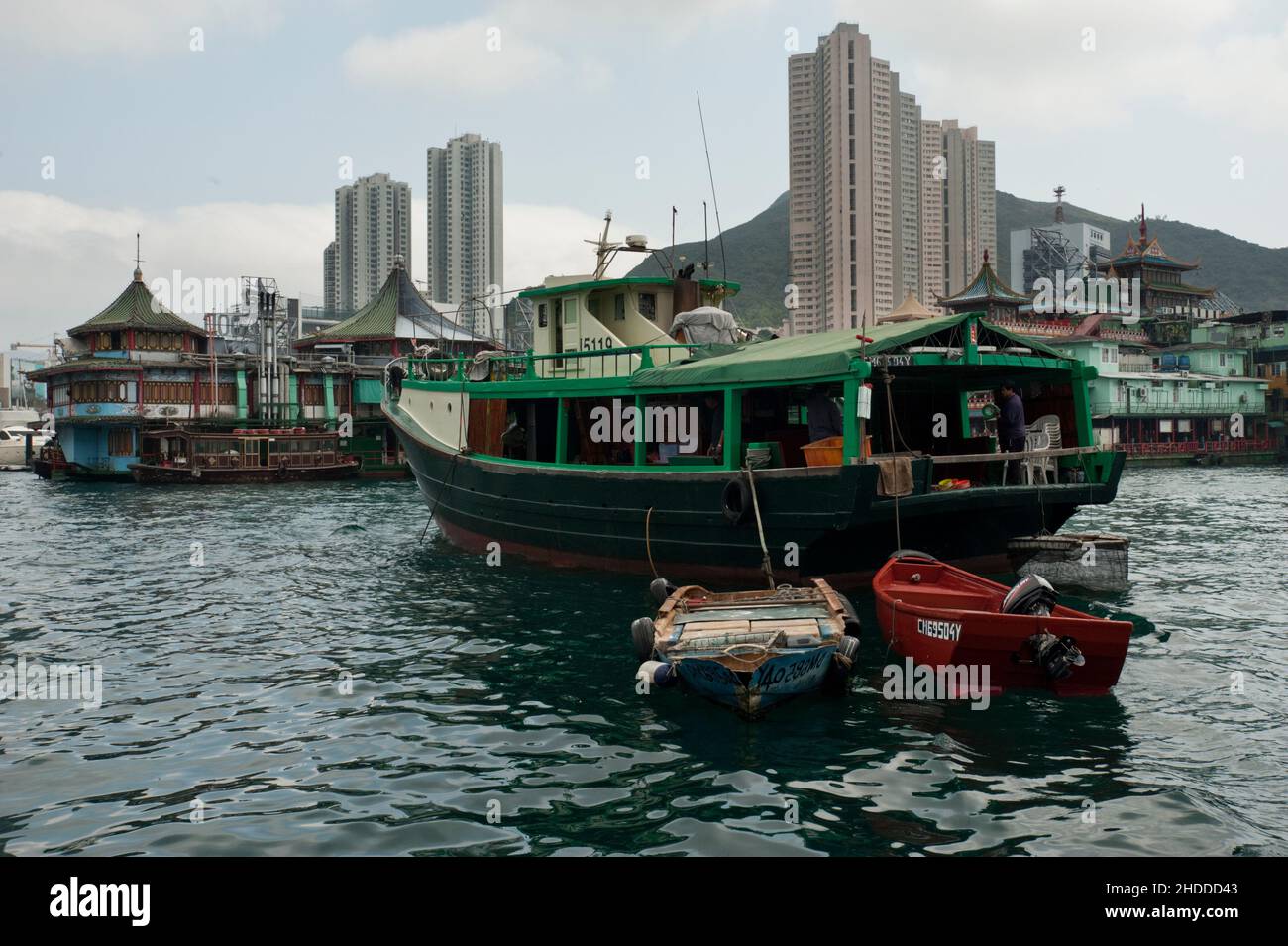 Tourist boats approach Jumbo Kingdom, a floating restaurant in Hong Kong's Aberdeen Harbour. Stock Photo