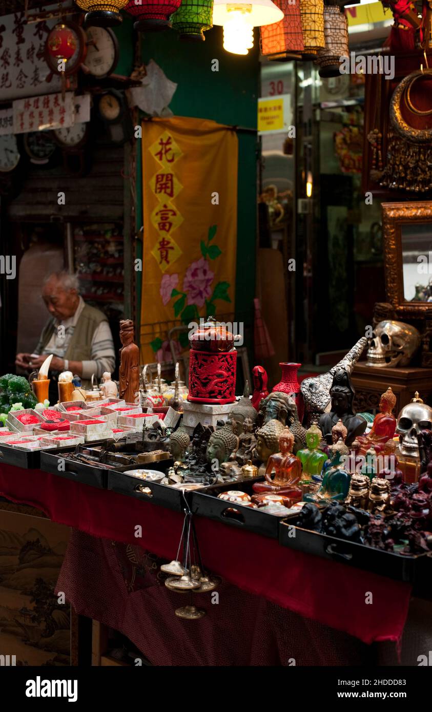 Buddhist icons for sale on Upper Lascar Row Antique Street Market, Hong Kong. Stock Photo