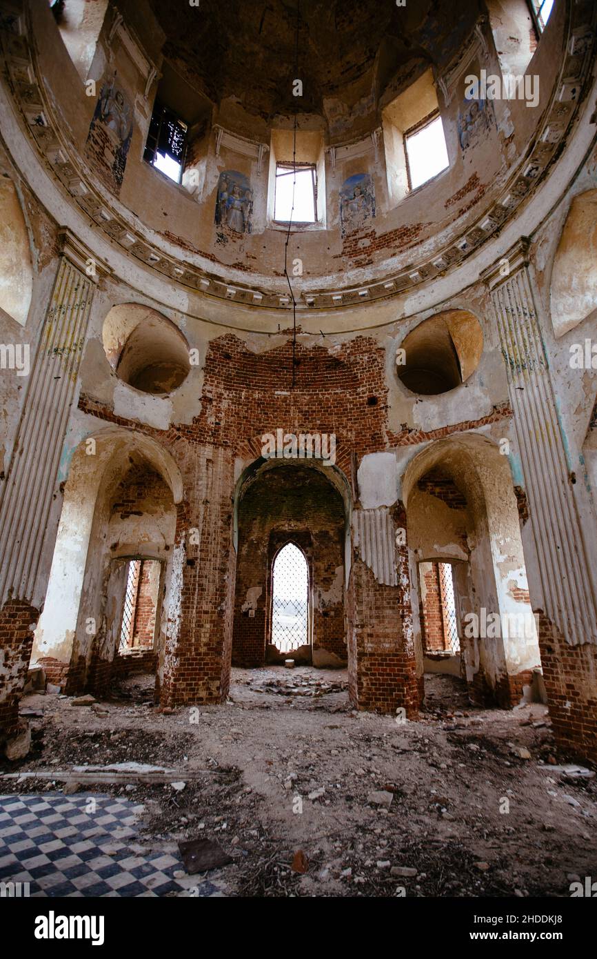 Inside the old ruined red brick church in gothic style. Stock Photo