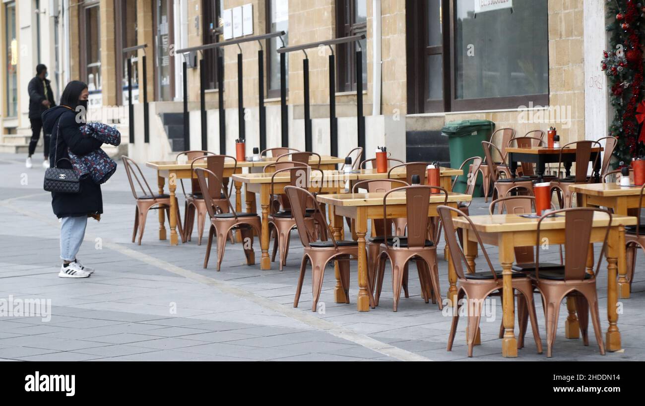 Nicosia, Cyprus. 5th Jan, 2022. A woman wearing a face mask stands in