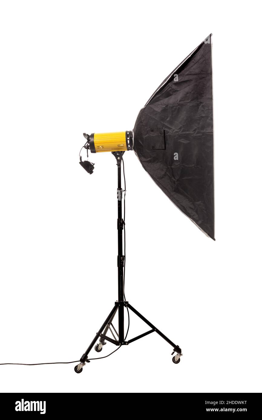 Flash light with softbox on stand with wheels. Studio lighting equipment isolated on white background. Stock Photo