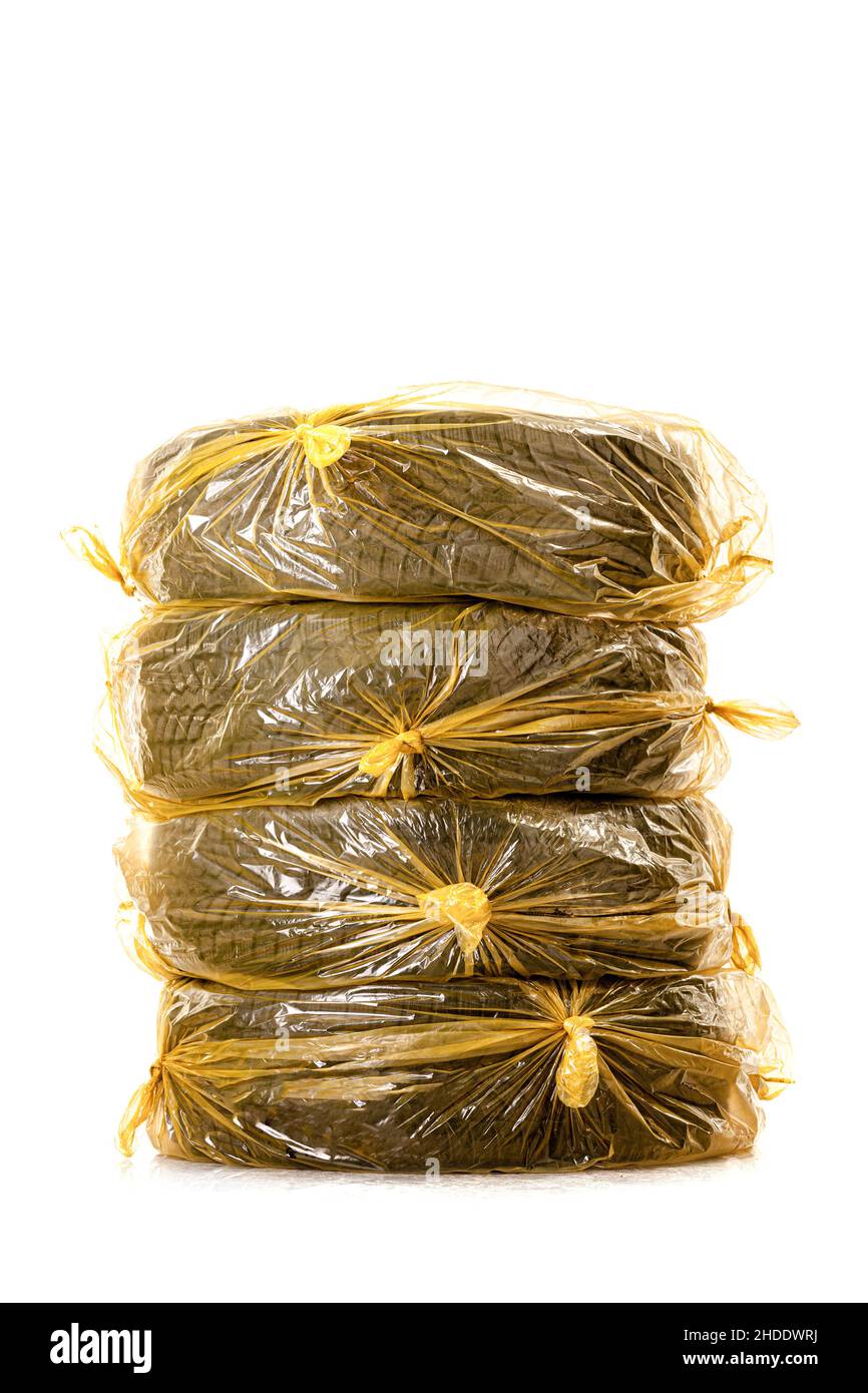 Car tires in yellow bags for storage. Set of four winter tyres isolated