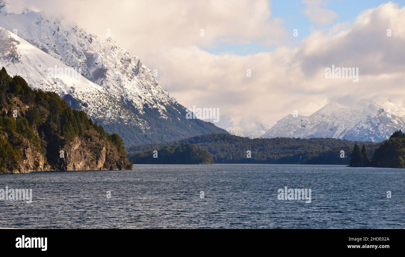 view of snowy mountains and lake from lake moreno bridge in circuit chico, bariloche, patagonia argentina Stock Photo