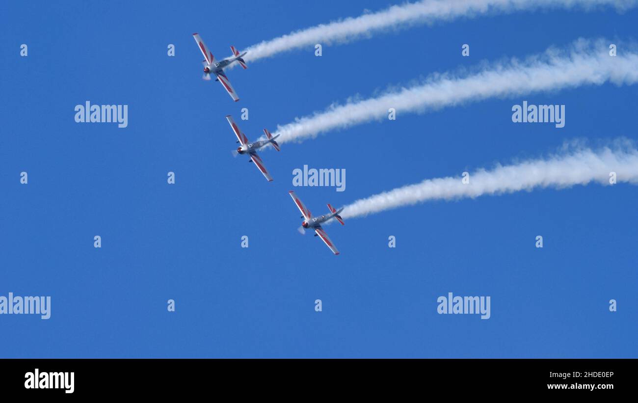 Thiene Italy OCTOBER, 16, 2021 Extreme planes in acrobatic demonstration. Teamwork for results concept. Copy Space. Yakovlev Yak-52 by YAK Italia Stock Photo