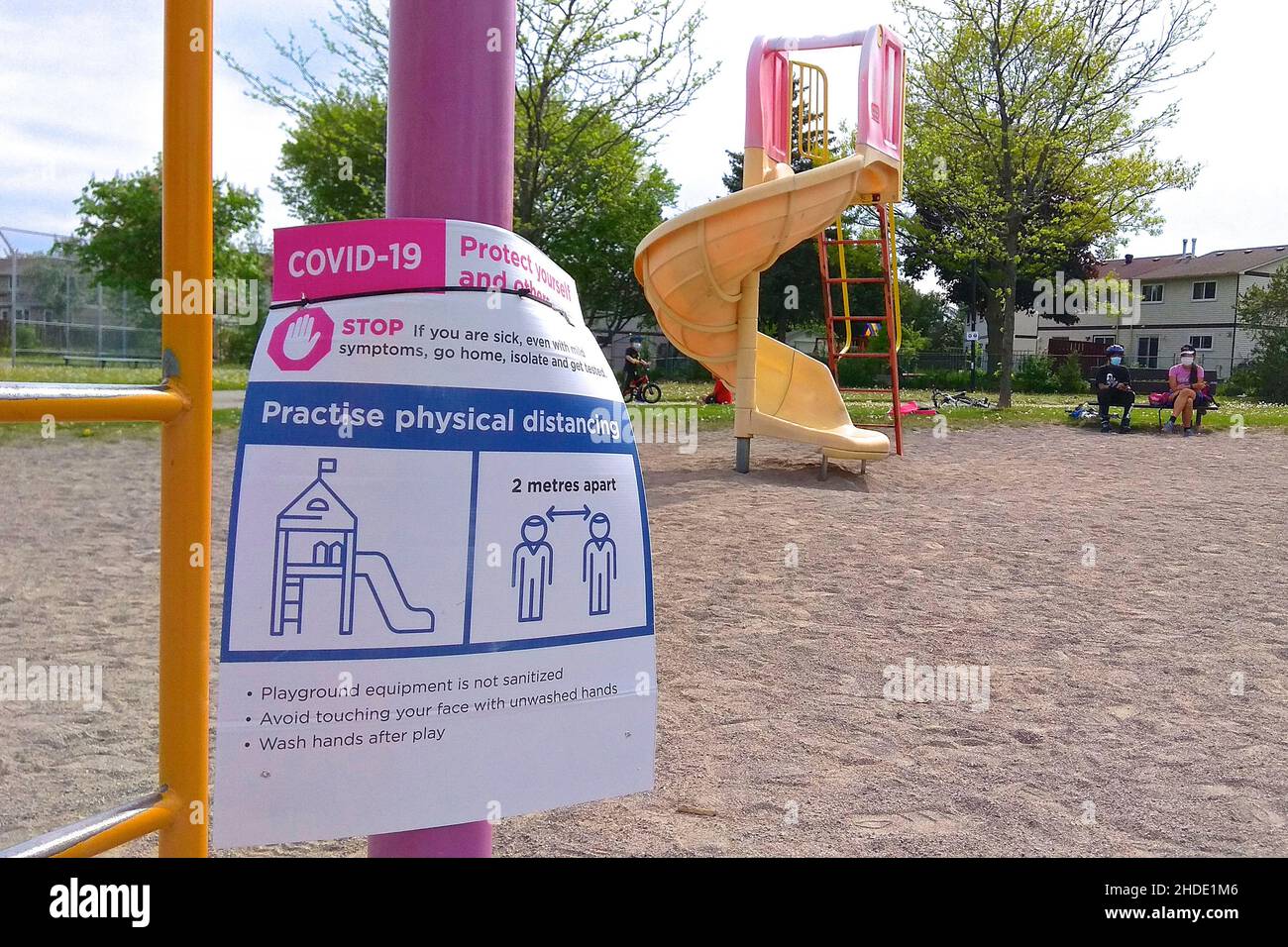 Toronto, Ontario, Canada - 19th May 2021: A poster of social distancing sign at the playground in Toronto, Canada. Stock Photo