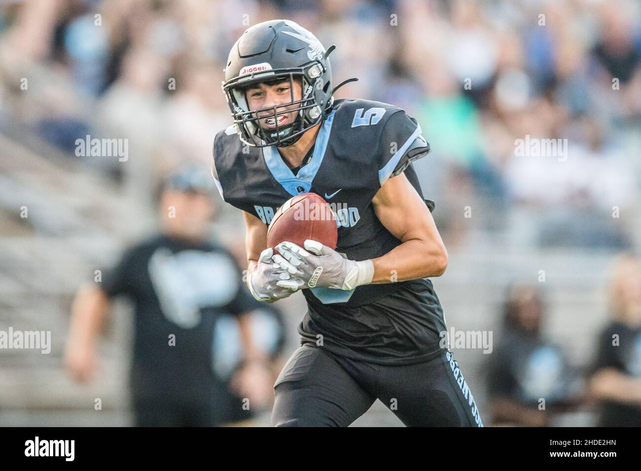August 27, 2021: Brazoswood's Cole Hagan (5) runs for positive yardage after catching a pass in a Texas University Interscholastic League (UIL) high school football game between the Santa Fe Indians and the Brazoswood Buccaneers at Hopper Field in Freeport, Texas. Prentice C. James via CSM Stock Photo