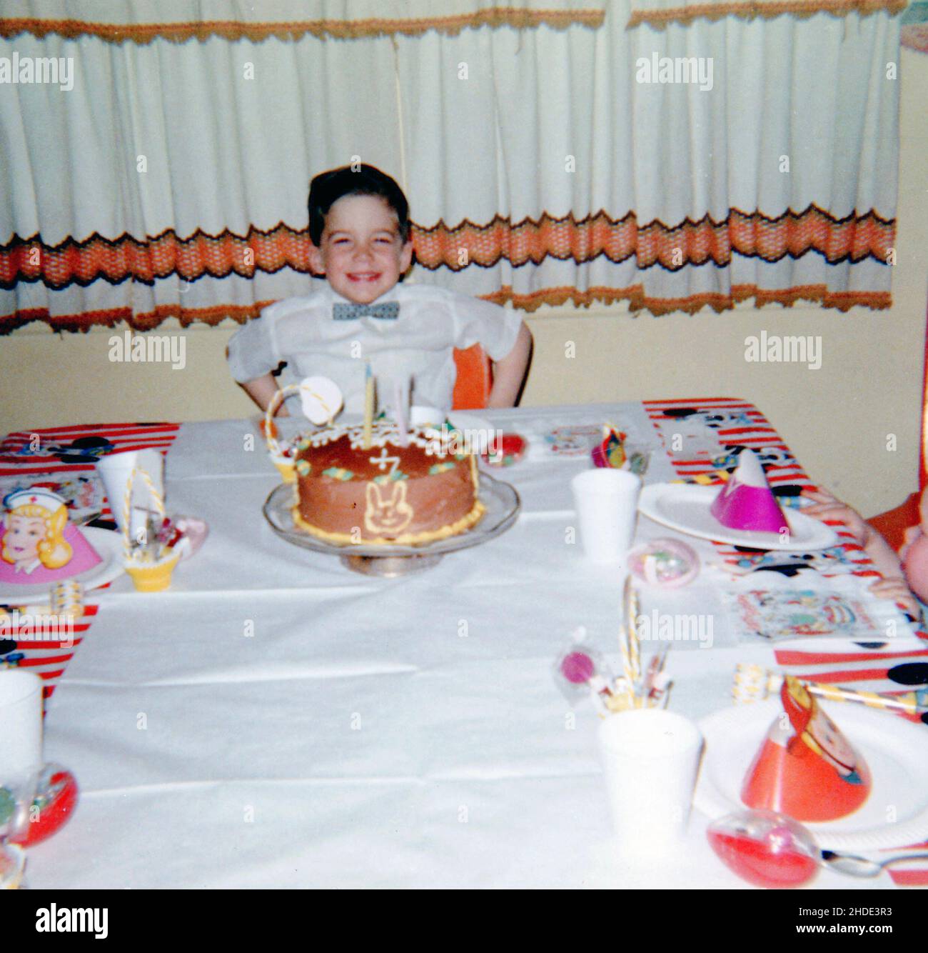 A little boy celebrating his 4th birthday in the late 1960s Stock Photo