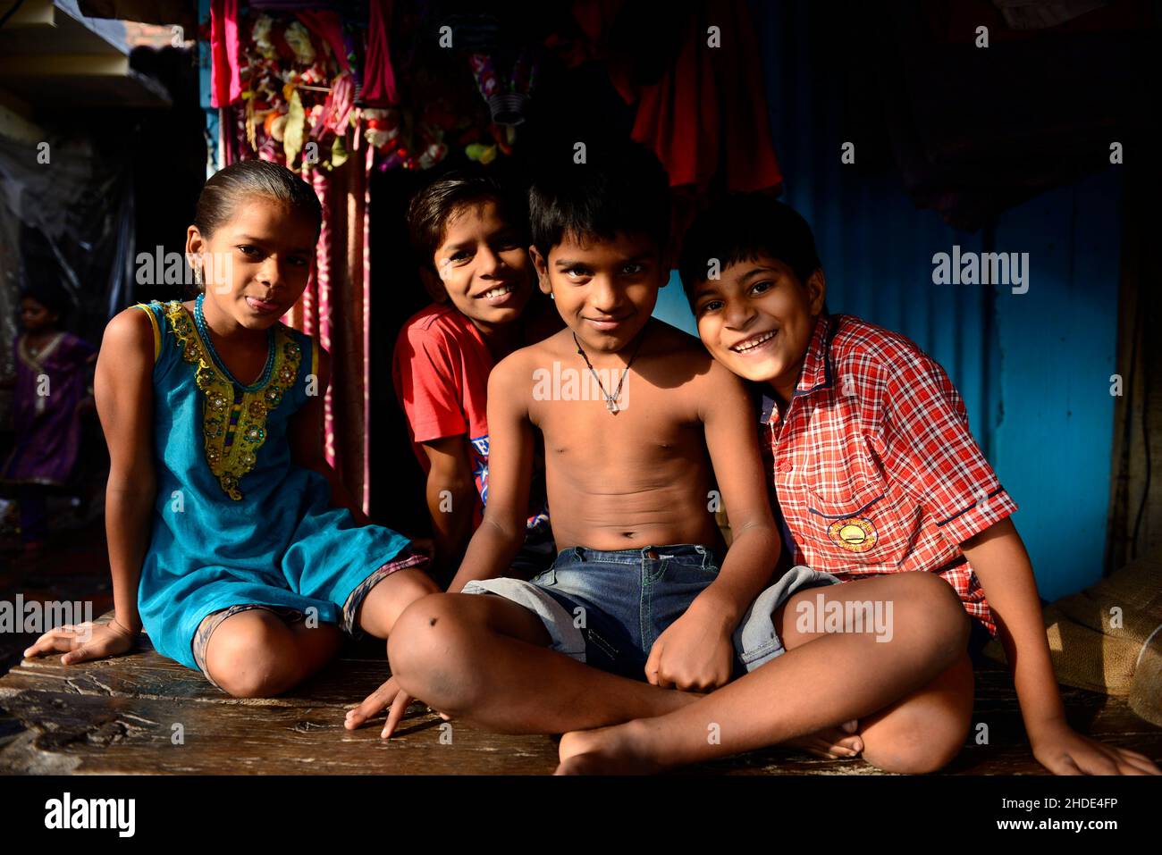 Indian children pose of a picture at the Saat Rasta Dhobi Ghat in Mumbai, India. Stock Photo