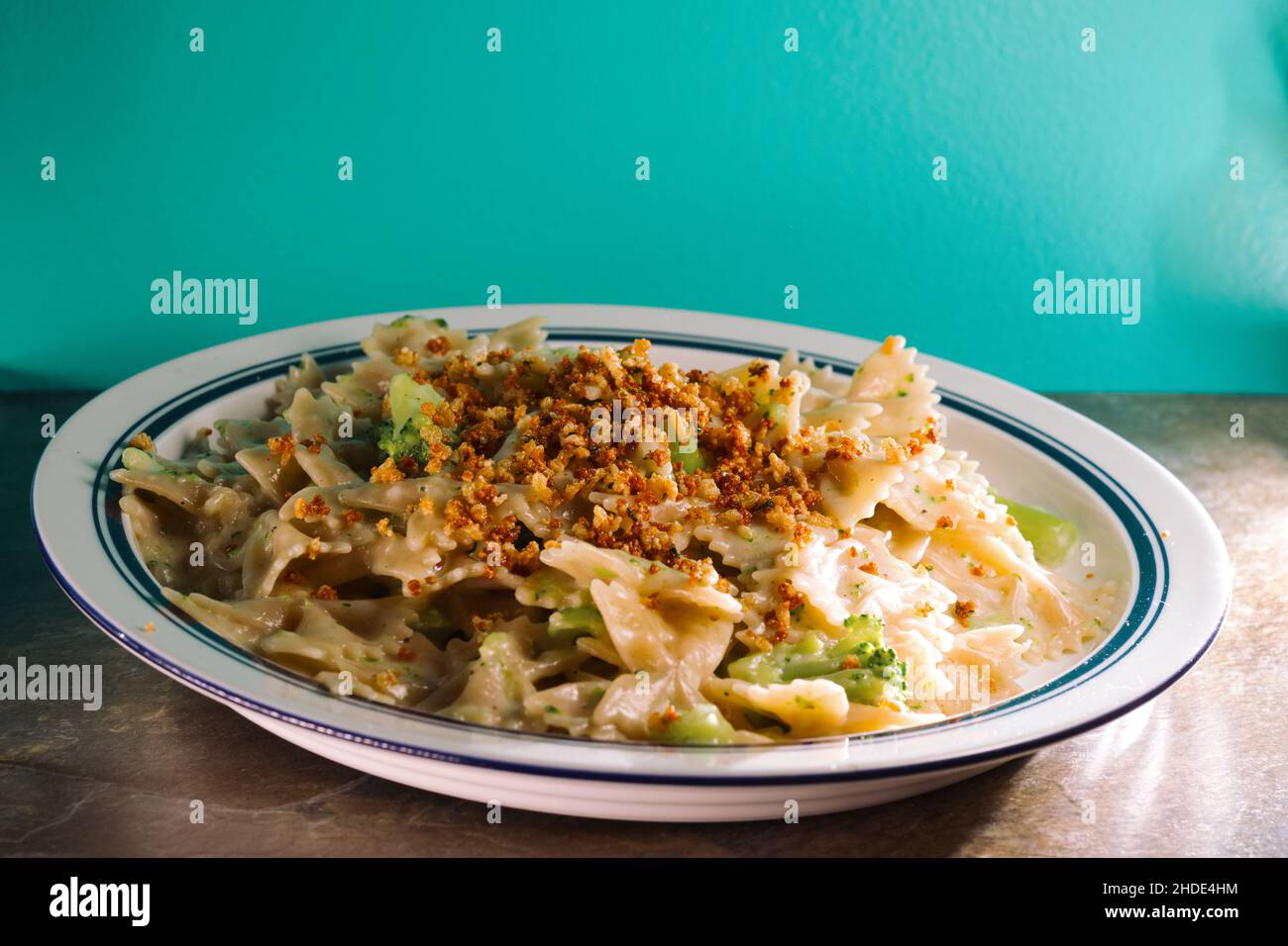 Creamy Italian alfredo bowtie pasta with broccoli Stock Photo Alamy